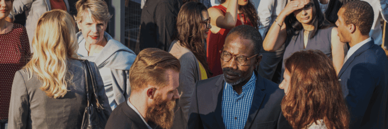 A diverse crowd of professionals networking